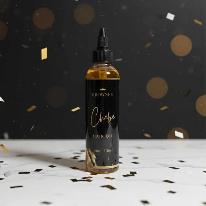 Hair oil bottle labeled 'Chebe' with confetti on a dark background