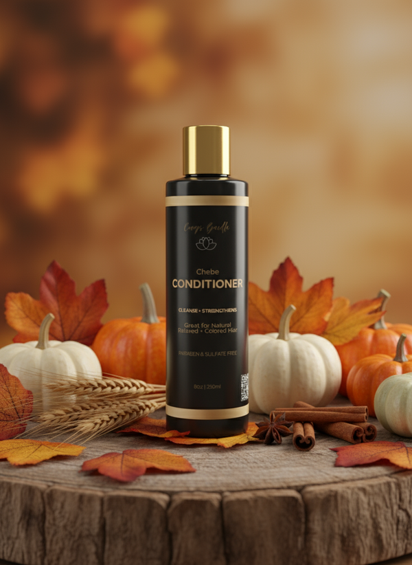 Black conditioner bottle with gold cap on a white background