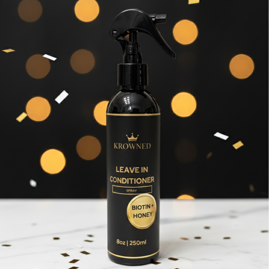 Krowned leave-in conditioner spray bottle with confetti on a dark background